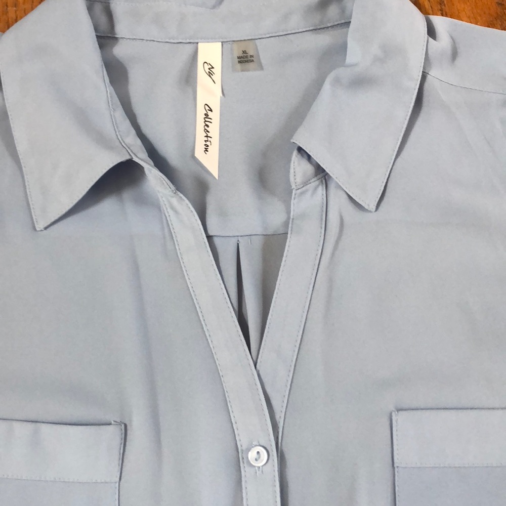 Sheer sleeveless shirt in soft blue